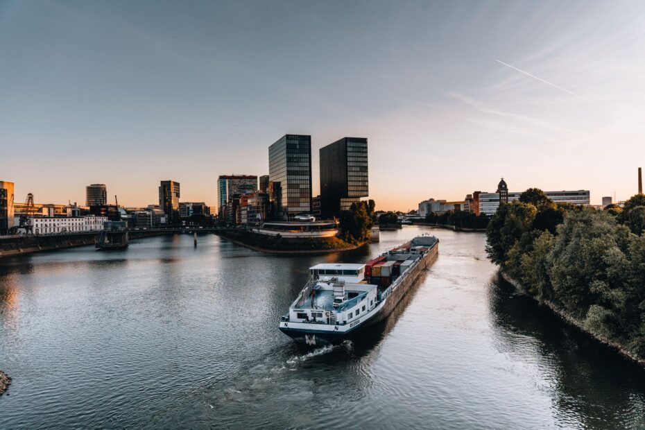cargo ship sailing on river in dusseldorf